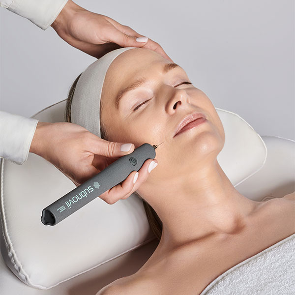 a woman undergoing subnovii skin treatment in fort myers and naples, fl